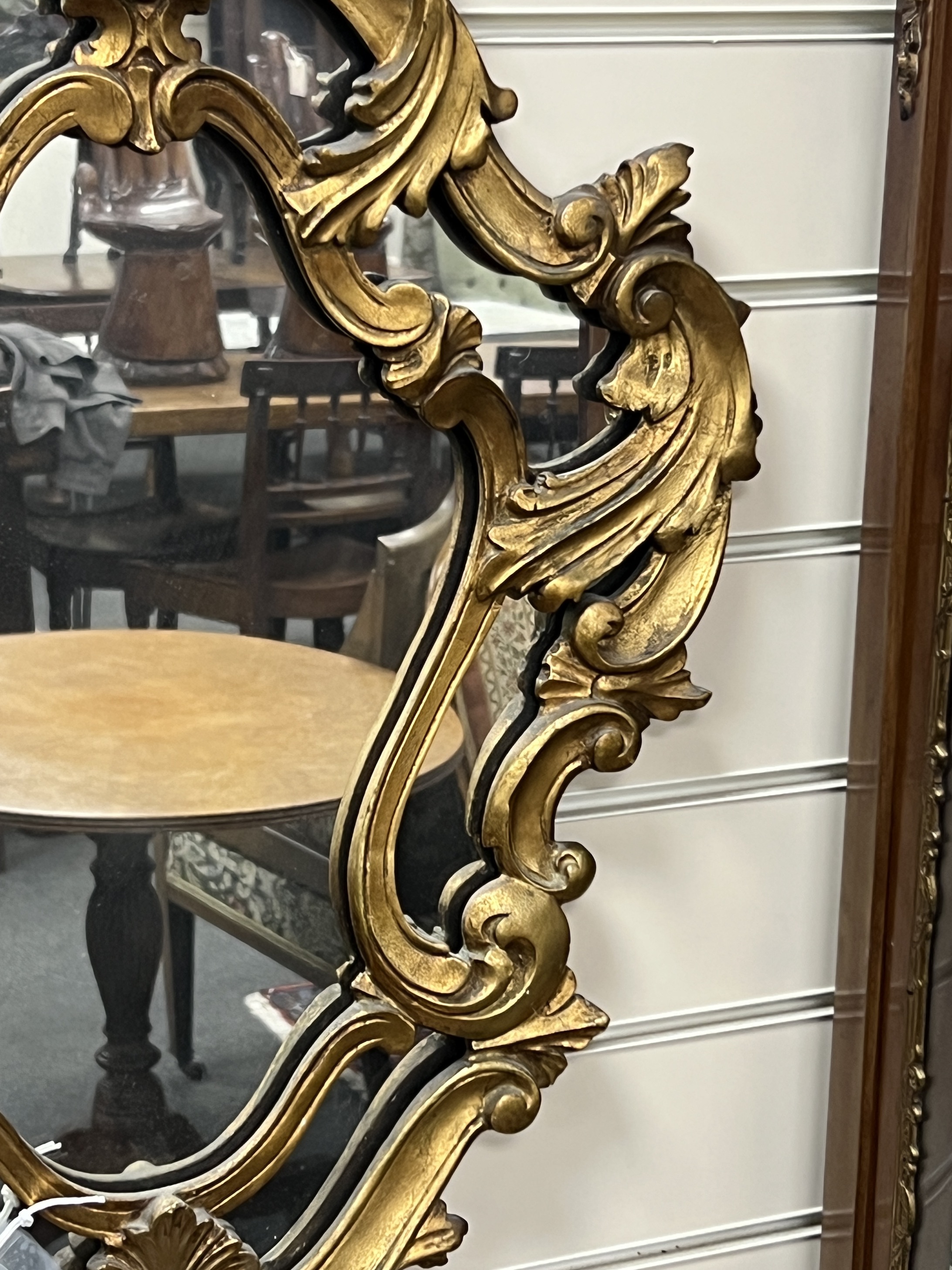 An 18th century style carved wood cartouche wall mirror, width 49cm, height 76cm